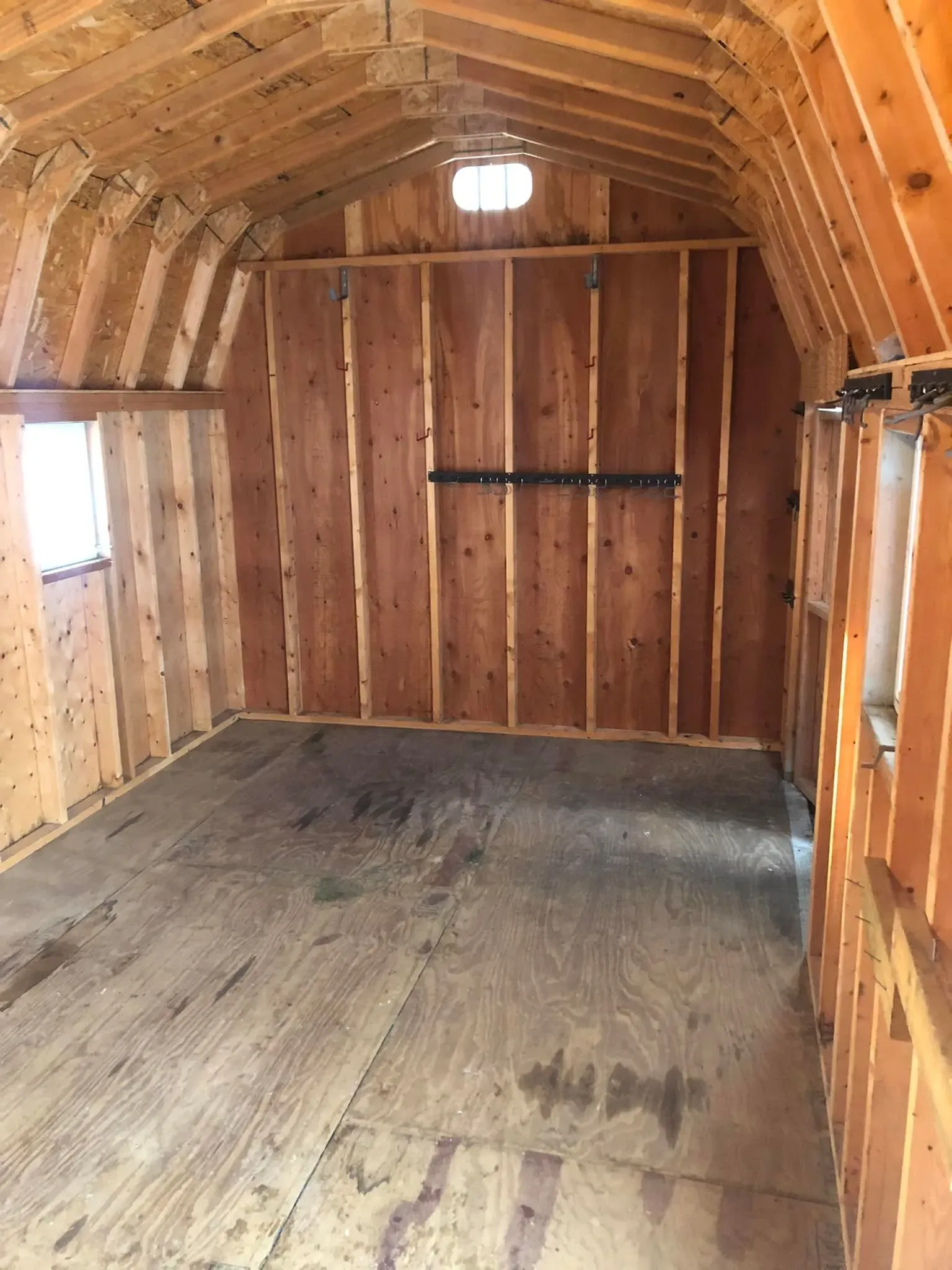 Shed Cleanout and Removal After: A packed storage shed was emptied and removed, leaving the surrounding area clear and open.